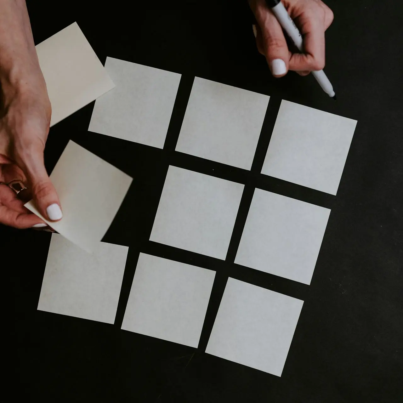 person holding white printer paper